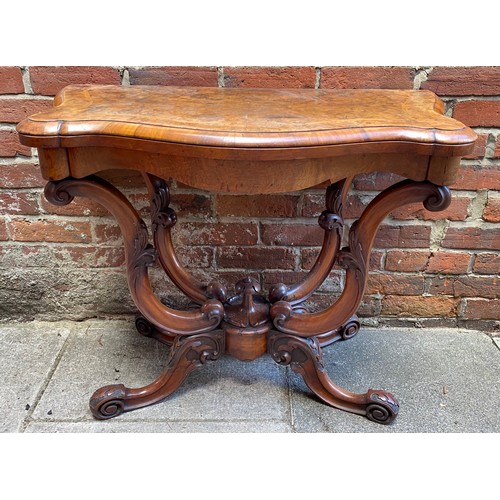 609 - A Victorian burr walnut and marquetry folding card table, with serpentine shaped top, green baize li... 