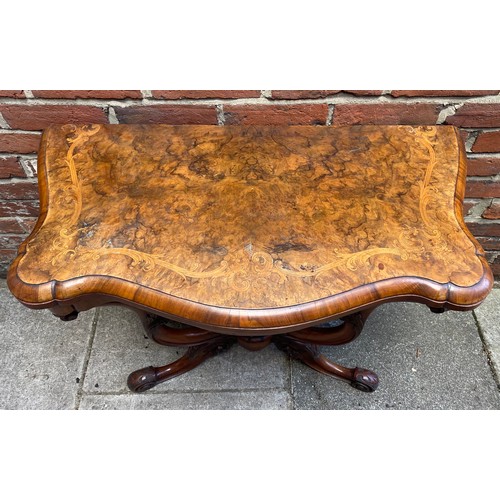 609 - A Victorian burr walnut and marquetry folding card table, with serpentine shaped top, green baize li... 