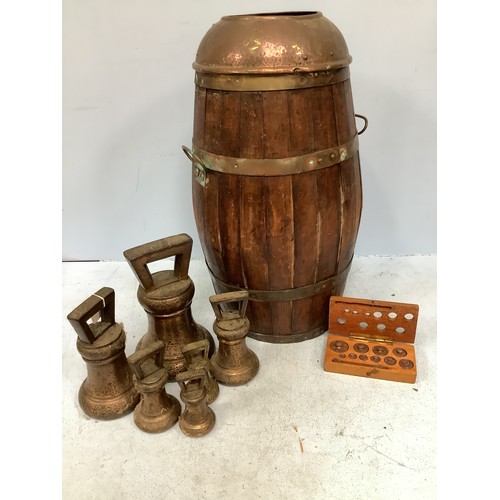 380 - A brass twin-handled coopered barrel with hammered copper top, 56cm high, together with six graduate... 