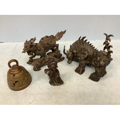 537 - Three various Chinese bronze figures including a Kylin, horned beast of burden and a ram holding a s... 