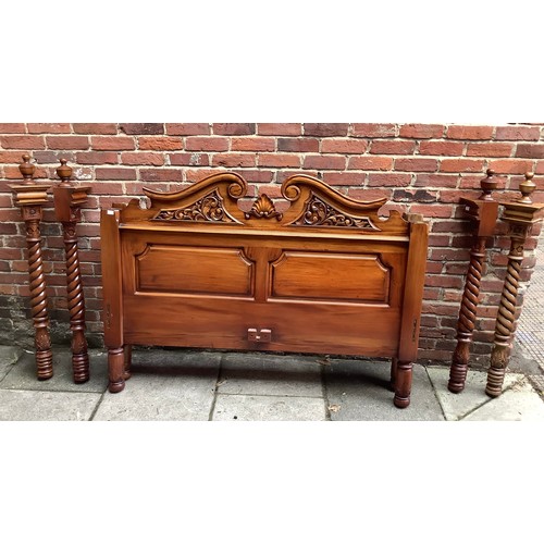 575 - A late 20th century stained and carved walnut four-poster bed, complete with side rails, slats, end ... 