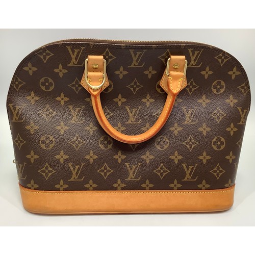 402 - A ladies Louis Vuitton Alma handbag, in the brown monogram coated canvas design, with light tan leat... 