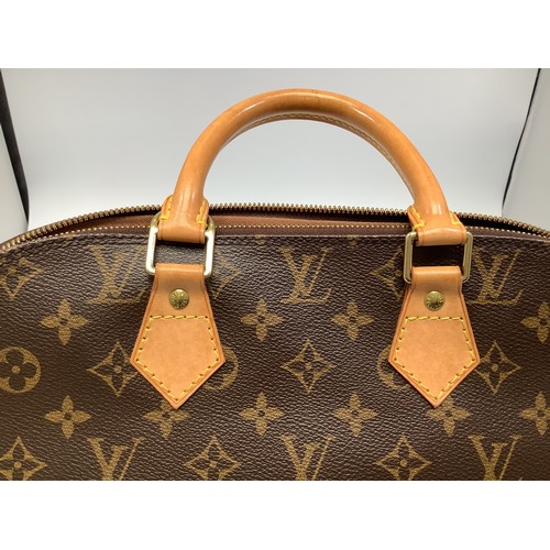 402 - A ladies Louis Vuitton Alma handbag, in the brown monogram coated canvas design, with light tan leat... 