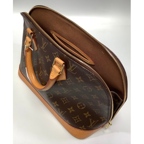 402 - A ladies Louis Vuitton Alma handbag, in the brown monogram coated canvas design, with light tan leat... 