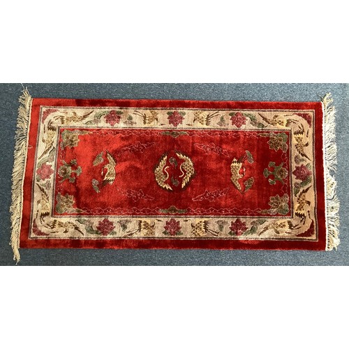 471 - Three various hand knotted rugs including a Chinese silk rug decorated with cranes and flowers to a ... 