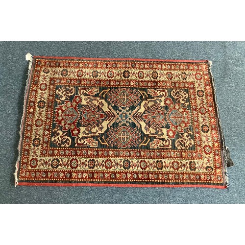 471 - Three various hand knotted rugs including a Chinese silk rug decorated with cranes and flowers to a ... 