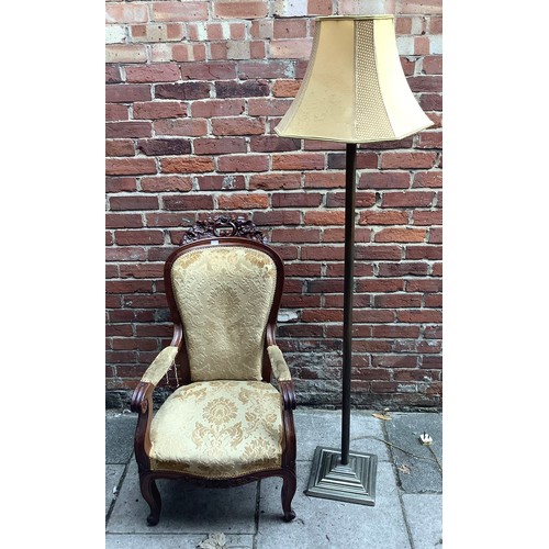 476 - A metal standard lamp raised on stepped square base together with a Victorian parlour chair with flo... 