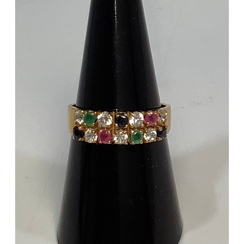 263 - An 18ct gold ring, claw set with 14 round faceted, white, green, pink and blue coloured stones, prob... 