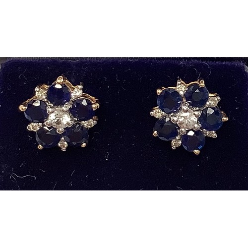 258 - A pair of 14ct gold, white sapphire and sapphire, diamond cluster stud earrings, each with centrally... 