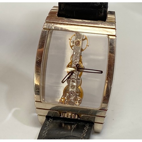 169 - An unusual 18ct white gold Corum Golden Bridge wristwatch, the clear dial with minute and hour hands... 