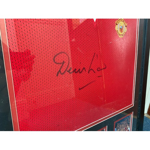 348 - A framed replica 1972/74 Manchester United shirt, signed by the club’s third all-time top goalscorer... 