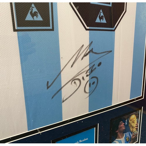 349 - A framed replica Argentina shirt by Le Coq Sportif, bearing the signature of two-time Ballon d’Or wi... 