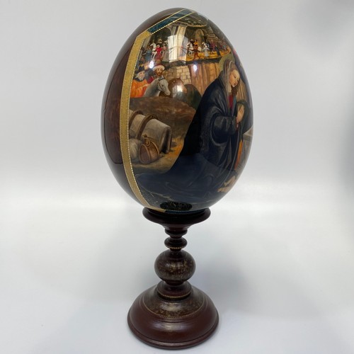 337 - A St Petersburg hand-painted and laquered papier-mache egg depicting the Adoration of the Magi, sign... 