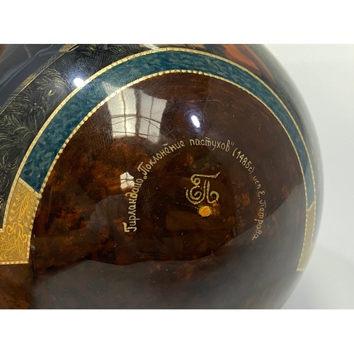 337 - A St Petersburg hand-painted and laquered papier-mache egg depicting the Adoration of the Magi, sign... 