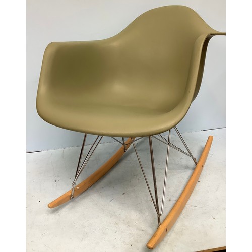 544 - After Charles & Ray Eames for Herman Miller, a modern copy of an RAR (Rocking Armchair Rod Base) roc... 