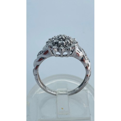 188 - A 9ct white gold dress ring, set with small round diamonds in a cluster design, with rope effect sho... 