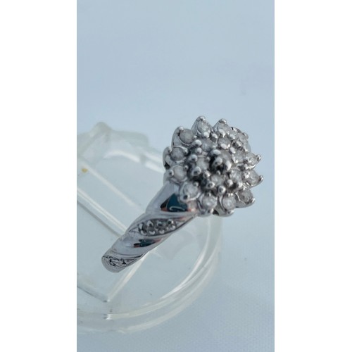 188 - A 9ct white gold dress ring, set with small round diamonds in a cluster design, with rope effect sho... 