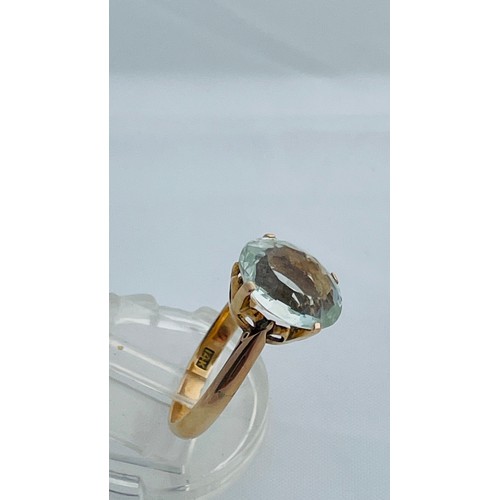 198 - A 14ct gold dress ring set with oval green faceted stone, possibly Aquamarine, ring weighs 3.5 grams... 