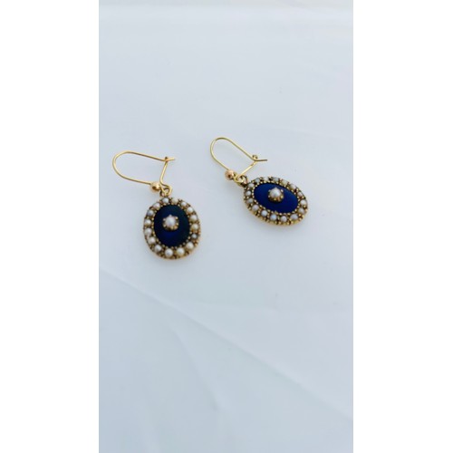 201 - A pair of 15ct gold oval shaped drop earrings, set with seed pearls and blue enamel, on 9ct gold wir... 