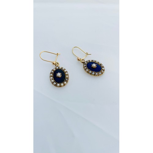 201 - A pair of 15ct gold oval shaped drop earrings, set with seed pearls and blue enamel, on 9ct gold wir... 