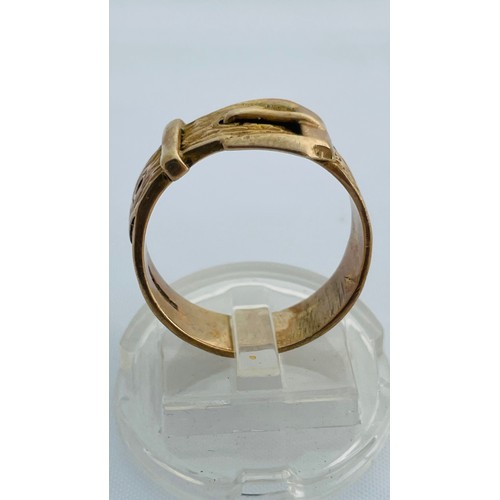 205 - A 9ct gold gents buckle ring, weighing 6.4 grams, finger size T.