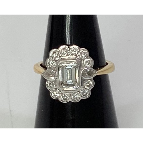 234 - An 18ct yellow gold and diamond cluster ring, centrally bezel set an emerald-cut diamond, extimated ... 