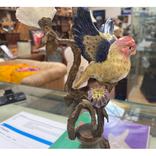 461 - A pair of bronze figural candlesticks by Mark Roberts, with colourful porcelain birds perched on twi... 