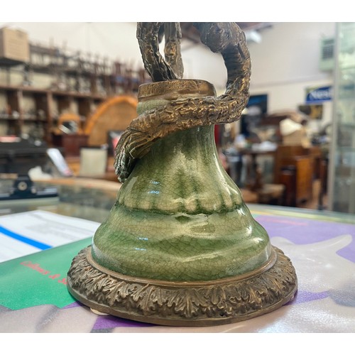 461 - A pair of bronze figural candlesticks by Mark Roberts, with colourful porcelain birds perched on twi... 