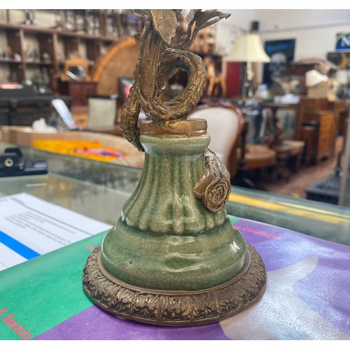 461 - A pair of bronze figural candlesticks by Mark Roberts, with colourful porcelain birds perched on twi... 