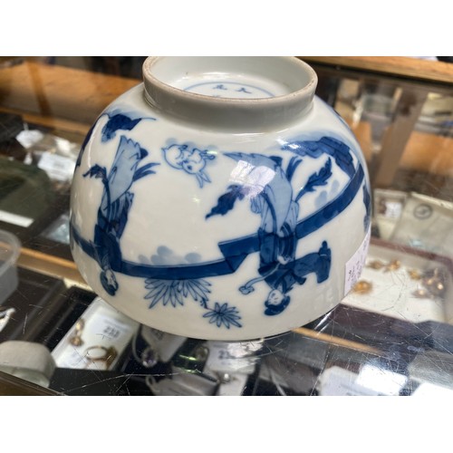 66 - A Chinese porcelain blue and white bowl decorated with ladies in a walled garden with a rabbit, Chen... 