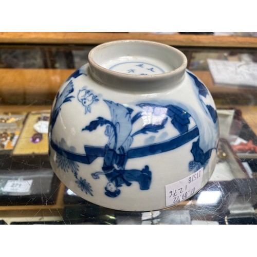 66 - A Chinese porcelain blue and white bowl decorated with ladies in a walled garden with a rabbit, Chen... 