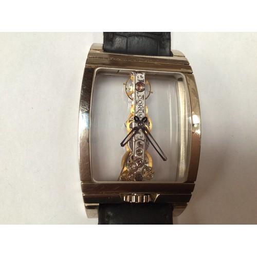 169 - An unusual 18ct white gold Corum Golden Bridge wristwatch, the clear dial with minute and hour hands... 