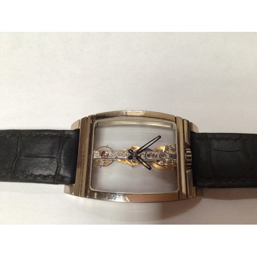 169 - An unusual 18ct white gold Corum Golden Bridge wristwatch, the clear dial with minute and hour hands... 