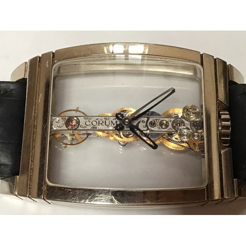 169 - An unusual 18ct white gold Corum Golden Bridge wristwatch, the clear dial with minute and hour hands... 