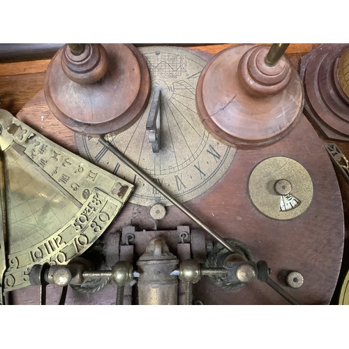 418 - Four various sundials including a circular sundial with a brass cannon and brass dial, compass and d... 