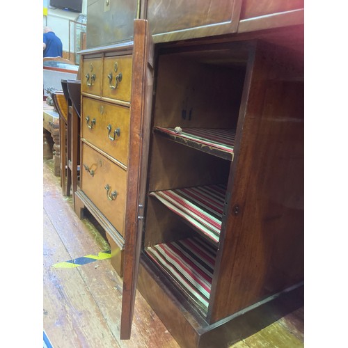 596 - A 19th century flamed mahogany twin-pedestal sideboard of small proportions, with three central frie... 