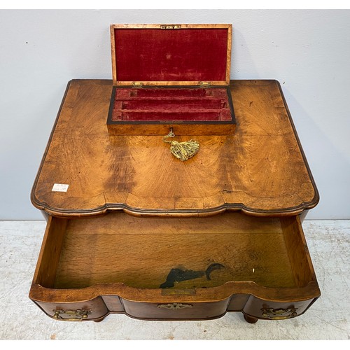 262 - An English late 19th / early 20th century walnut lowboy in the Queen Anne style, with shaped top and... 