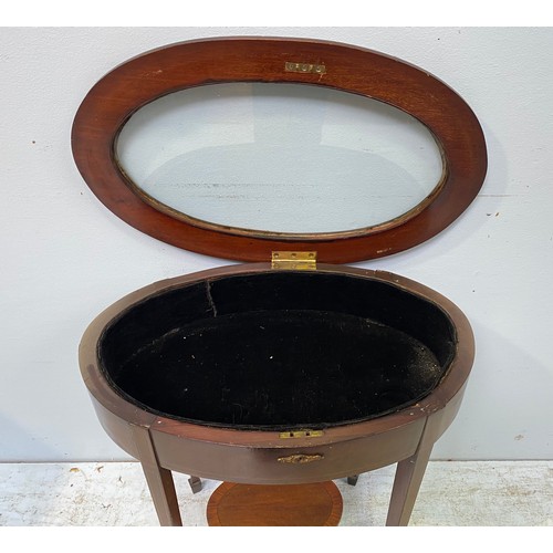 271 - An Edwardian inlaid mahogany oval bijouterie table, with cross-banded and glazed lockable hinged top... 