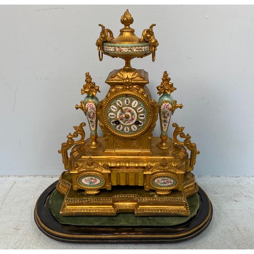 231 - A 19th century French gilt-metal and porcelain mantel clock, the round turquoise enamel dial with bl... 