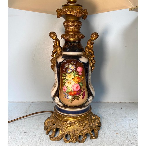 239 - A pair of gilt-metal mounted porcelain lamps, with hand-painted floral decoration to sides and gilt-... 