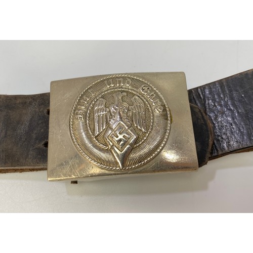 560 - A 1930's leather Hitler Youth belt, the buckle with Reichsadler, Swastika and Blut und Ehre to centr... 