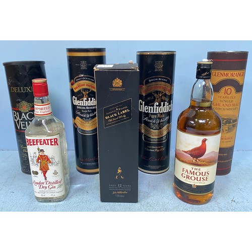 581 - Seven assorted bottled spirits comprising Johnnie Walker Black label aged 12 years, 1.125 litre bott... 