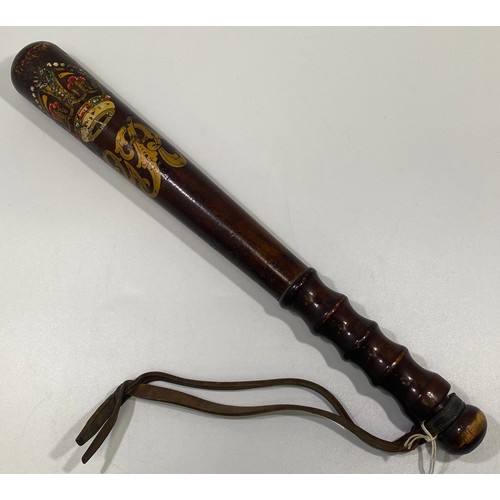 551 - A George V wooden police truncheon, with tapering shaft and fluted grip, gilt and polychrome crown a... 