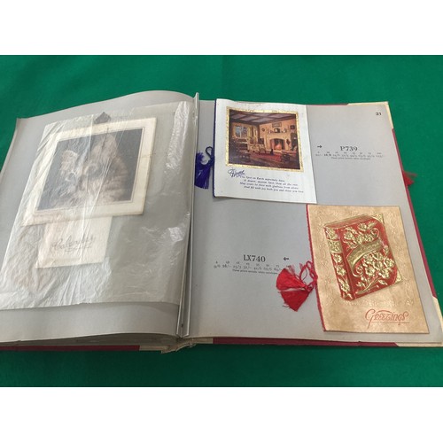 163 - Two old albums containing a collection of Christmas greetings cards and a modern album containing ma... 