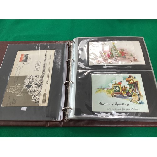 163 - Two old albums containing a collection of Christmas greetings cards and a modern album containing ma... 