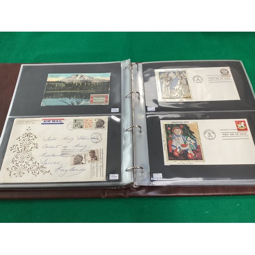 163 - Two old albums containing a collection of Christmas greetings cards and a modern album containing ma... 