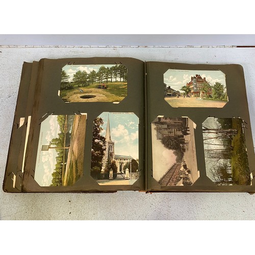 172 - An Edwardian postcard album, containing approximately 130 postcards, mostly topographical, monochrom... 