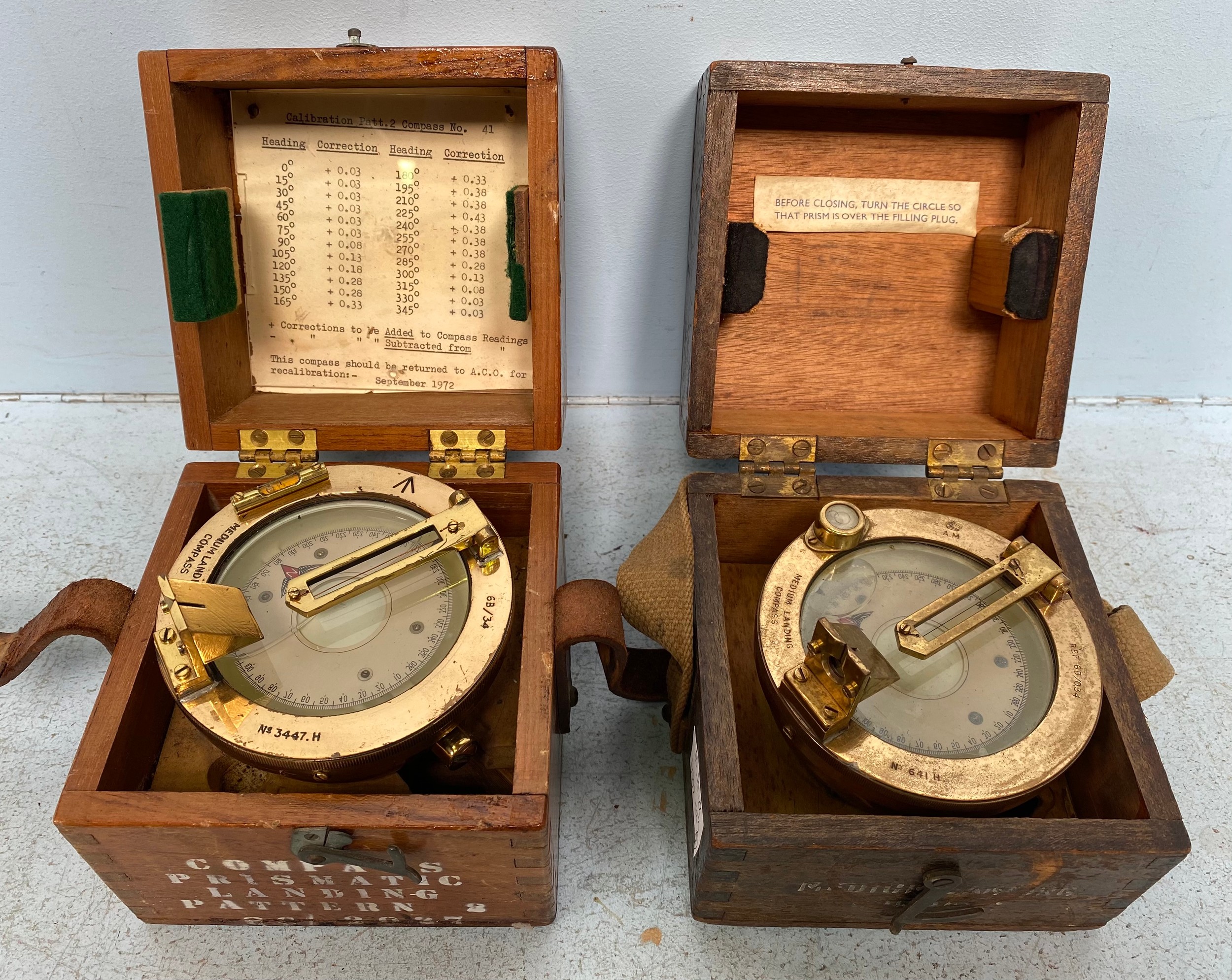 Two various brass Adnirlaty Pattern Medium Landing Compasses, in fitted