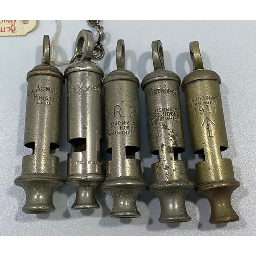 555 - Five various whistles including a WW1 Huddson No.1 dated 1917 with broad arrow, ACME City, ARP and 2... 