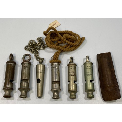 557 - Six various whistles including 'Portsmouth Police' and 5x Metropolitans, one leather pouch (6)